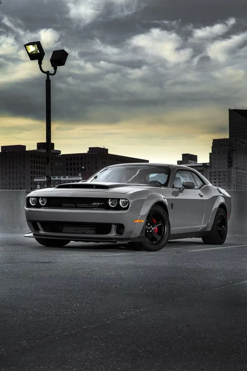 Dodge Challenger SRT Demon detailed and parked on a rooftop at dusk
